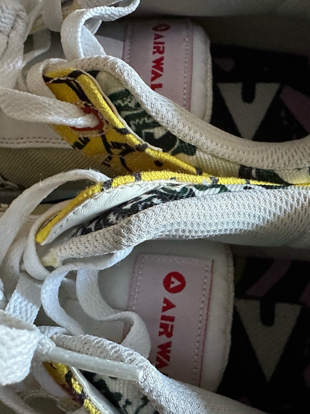 Airwalk White Sneakers with Yellow Floral Accents and Pink Tongue Tag